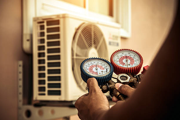 Professional Air Conditioning Service technician working in West Falmouth, MA
